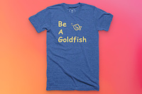 A blue shirt with yellow text reading "Be A Goldfish" with a cartoon goldfish.