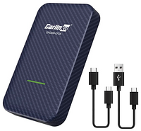 A small rectangular box in carbon fiber-like material with USB-A and USB-C charging cords next to it.