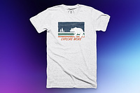 A shirt depicting a polar bear walking across a star-studded sky with Explore More below it.