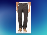 A person wears dark cargo pants with hands resting by the sides. They stand on a gradient blue background, wearing tan sneakers.