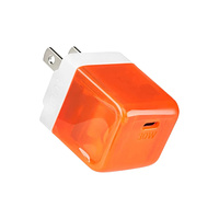 A small square charging brick with translucent orange plastic.