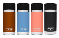 Four cylindrical bottles lined up in a row.