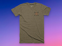 A brown shirt with a crossed arrows icon in the top left corner.